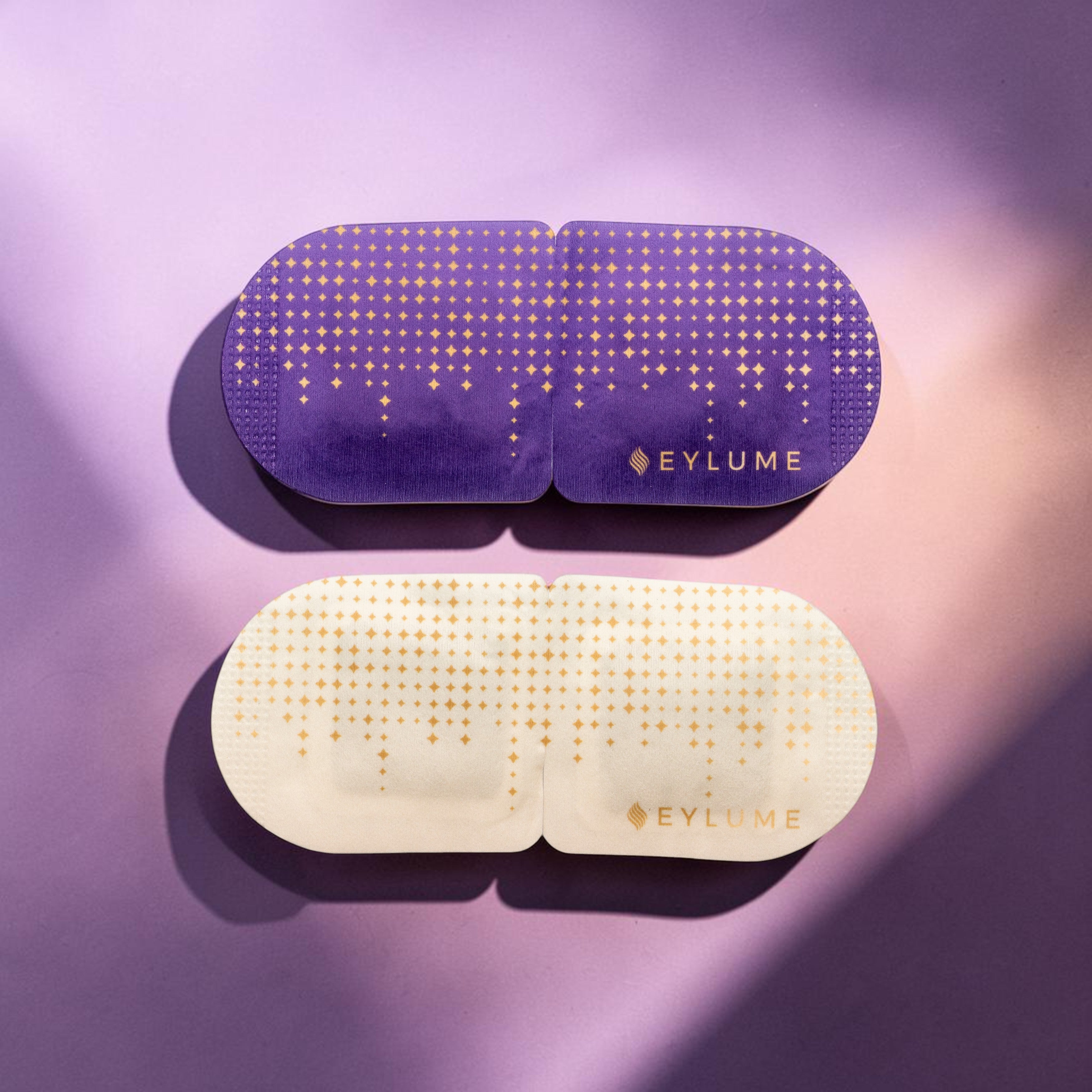 EYLUME RENEW self-heating eye masks in lavender and unscented variants on a soft lavender and blush studio background.